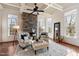 Cozy sitting area with stone fireplace and hardwood floors at 193 N Grande Overlook Dr, Clayton, NC 27527