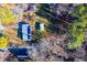 Aerial view of a house with solar panels and a detached shed at 2125 Eveton Ln, Sanford, NC 27330