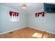 Bright bedroom with hardwood floors and two windows at 2125 Eveton Ln, Sanford, NC 27330