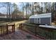 Wooden deck overlooking backyard with storage shed at 2125 Eveton Ln, Sanford, NC 27330