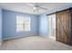 Spacious bedroom with ceiling fan and barn door at 2248 Ventana Ln, Raleigh, NC 27604