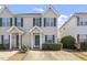 Front view of two story house with green door at 2248 Ventana Ln, Raleigh, NC 27604