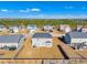 Aerial view of houses on a street, showing backyards at 232 Crane Way, Bunnlevel, NC 28323