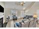 Spacious living room with vaulted ceiling, fireplace, and leather furniture at 232 Crane Way, Bunnlevel, NC 28323