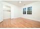 Well-lit bedroom with hardwood floors and closet at 2509 Holbrook Ct, Raleigh, NC 27604