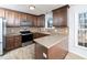 Modern kitchen with stainless steel appliances and granite countertops at 2509 Holbrook Ct, Raleigh, NC 27604