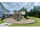 Community playground with playset and slides at 316 Bedivere Ln, Durham, NC 27703