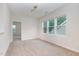 Bright bedroom with neutral carpeting and multiple windows at 344 Rocky Crest Ln, Wake Forest, NC 27587