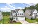 Two-story house with attached garage and landscaping at 344 Rocky Crest Ln, Wake Forest, NC 27587