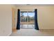 Bright bedroom with sliding glass doors leading to a patio and view of trees at 360 Skymont Dr, Holly Springs, NC 27540