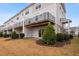 Townhouse exterior with multiple decks and grassy area at 360 Skymont Dr, Holly Springs, NC 27540