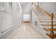 Bright entryway with tile floors and staircase at 4701 Regalwood Dr, Raleigh, NC 27613