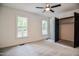 Bright bedroom with carpet, ceiling fan, and ample closet space at 525 Green Willow Cir, Wendell, NC 27591