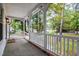 Front porch view showcasing a wooded neighborhood setting at 525 Green Willow Cir, Wendell, NC 27591