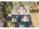 Aerial view showcasing home's roofline and backyard deck at 5365 N Nc Highway 49, Burlington, NC 27217