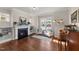 Living room with fireplace, built-in shelving, hardwood floors and two armchairs at 6604 Truxton Ln, Raleigh, NC 27616