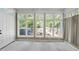 Sunroom with multiple windows, offering backyard views at 6614 Glen Forrest Dr, Chapel Hill, NC 27517