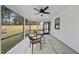 Screened porch features a ceiling fan and comfortable seating at 709 Chandler Rd, Durham, NC 27703