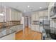 Kitchen with granite countertops, stainless steel appliances, and ample cabinet space at 7601 Matherly Dr, Wake Forest, NC 27587