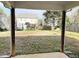 Covered patio overlooking a fenced backyard at 112 Ryder Cup Cir, Raleigh, NC 27603