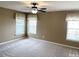 Bedroom with carpet, ceiling fan, and two windows at 112 Ryder Cup Cir, Raleigh, NC 27603