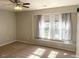 Bright bedroom with a large window and ceiling fan at 112 Ryder Cup Cir, Raleigh, NC 27603