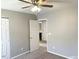 Bedroom with ceiling fan and access to bathroom at 112 Ryder Cup Cir, Raleigh, NC 27603