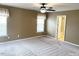 Bedroom with carpet, ceiling fan, and access to bathroom at 112 Ryder Cup Cir, Raleigh, NC 27603