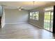 Spacious living room with hardwood floors and sliding glass door at 112 Ryder Cup Cir, Raleigh, NC 27603