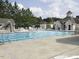 Community lap pool with water slide and lounge chairs at 112 Ryder Cup Cir, Raleigh, NC 27603