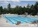 Community lap pool with water slide and lounge chairs at 112 Ryder Cup Cir, Raleigh, NC 27603