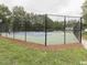 Community tennis court with chain link fence at 112 Ryder Cup Cir, Raleigh, NC 27603