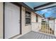 Inviting back porch with grey decking and white railings at 115 Kerr Dr, Roxboro, NC 27573