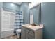 Clean bathroom with tub shower combo and vanity at 115 Kerr Dr, Roxboro, NC 27573