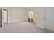 Bright bedroom with carpet flooring and ample closet space at 115 Kerr Dr, Roxboro, NC 27573