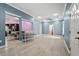 Open concept living and dining area with light gray walls and hardwood floors at 115 Kerr Dr, Roxboro, NC 27573