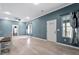 Spacious living room with light gray walls and wood-look floors at 115 Kerr Dr, Roxboro, NC 27573