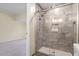 Modern shower with glass enclosure and marble tile at 115 Kerr Dr, Roxboro, NC 27573