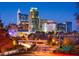 Night-time aerial view of the Raleigh, NC skyline and highway at 123 Hemlock Falls Trl # 187, Raleigh, NC 27603