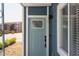 Light blue front door with keyless entry and sidelight window at 1309 Hudson Ave # A7, Durham, NC 27705