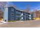 Apartment building with blue siding, multiple units, and outdoor stairs at 1309 Hudson Ave # D10, Durham, NC 27705