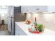 Bright kitchen with white cabinets, quartz countertops, and subway tile backsplash at 1309 Hudson Ave # D10, Durham, NC 27705