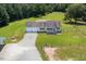 Aerial view of a house with a two-car garage and fenced yard at 1416 Chambers Rd, Rougemont, NC 27572