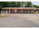 Rustic barn with stalls and a tractor, offering ample storage at 1416 Chambers Rd, Rougemont, NC 27572