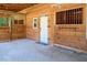 Entrance to a barn with multiple stalls and a white door at 1416 Chambers Rd, Rougemont, NC 27572