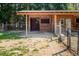 Exterior of a wooden barn with multiple stalls and a covered area at 1416 Chambers Rd, Rougemont, NC 27572