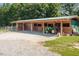Wooden barn with stalls, tractor, and covered parking at 1416 Chambers Rd, Rougemont, NC 27572