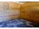 Empty horse stall with wooden walls and a rubber mat at 1416 Chambers Rd, Rougemont, NC 27572