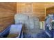 Horse stall with hay bales and a wheelbarrow at 1416 Chambers Rd, Rougemont, NC 27572