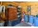 Interior of a barn stall with shelves, cabinets, and storage bins at 1416 Chambers Rd, Rougemont, NC 27572